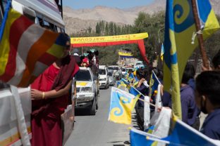 Well-wishers bearing the auspicious 16th Karmapa Dream Flag. Photo / Magda Jungowska