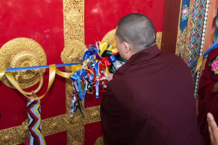 Thaye Dorje, His Holiness the 17th Gyalwa Karmapa, cutting the ribbon to inaugurate the Karma Dupgyud Choeling Monastery. Photo / Magda Jungowska