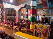 His Holiness Karmapa Thaye Dorje together with a gathering of Rinpoches, monks and nuns, performing the Grand Mahakala Puja