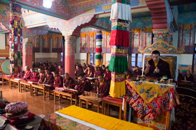 His Holiness the 17th Gyalwa Karmapa together with a gathering of Rinpoches, monks and nuns, performing the Grand Mahakala Puja