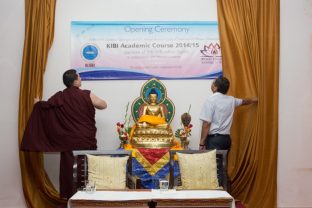 Thaye Dorje, His Holiness the 17th Gyalwa Karmapa, and the Chairman of Mewar University symbolically open the new academic semester by lighting a lamp and unveiling the poster. Photo/Norbu Zangpo