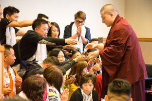 Thaye Dorje, His Holiness the 17th Gyalwa Karmapa, blesses the meditation beads of visiting students