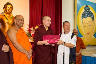 Thaye Dorje, His Holiness the 17th Gyalwa Karmapa, receiving a gift from the Maha Buddhist Vihara. Photo / Magda Jungowska