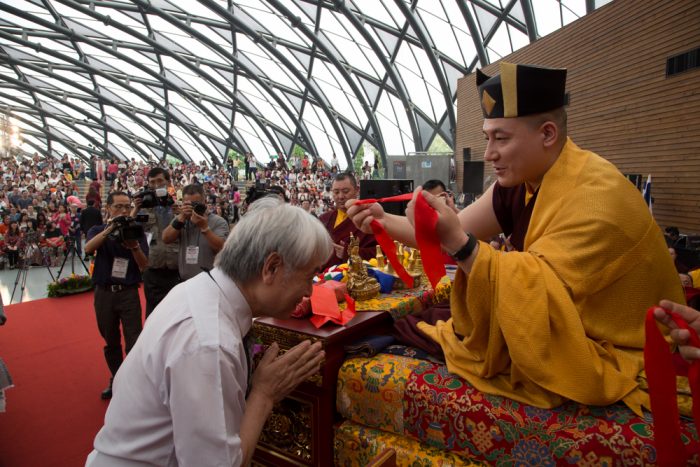 Thaye Dorje, His Holiness the 17th Gyalwa Karmapa, blessing an attendee