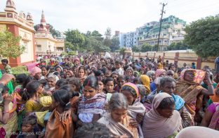 Blankets are distributed to poor people from Bodh Gaya, at the Kagyu Monlam, December 201