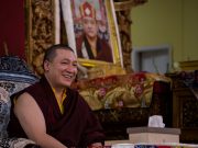Thaye Dorje, His Holiness the 17th Gyalwa Karmapa, with a photo of his late teacher His Holiness Kunzig Shamar Rinpoche, during the Karmapa Public Course at KIBI. Photo / Norbu Zangpo