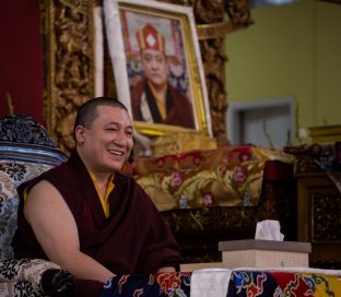 Thaye Dorje, His Holiness the 17th Gyalwa Karmapa, with a photo of his late teacher His Holiness Kunzig Shamar Rinpoche, during the Karmapa Public Course at KIBI. Photo / Norbu Zangpo