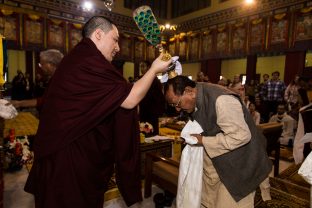 Thaye Dorje, His Holiness the 17th Gyalwa Karmapa blesses Professor Sempa Dorje during the Chenresig empowerment at the KIBI Public Course