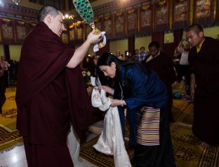 Thaye Dorje, His Holiness the 17th Gyalwa Karmapa blesses his wife Sangyumla during the Chenresig empowerment at the KIBI Public Course