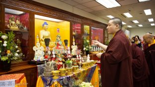 Thaye Dorje, His Holiness the 17th Gyalwa Karmapa, in front of the altar at the New Horizon Buddhist Association Bodhi Path Buddhist Centre in Hong Kong