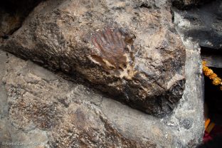 A hand print of Guru Rinpoche in the rock next to the cave