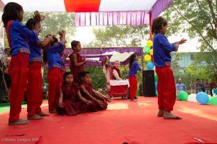 Pupils perform for Thaye Dorje, His Holiness the 17th Gyalwa Karmapa, at the Bodhi Tree School in Bodh Gaya