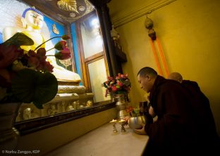 Thaye Dorje, His Holiness the 17th Gyalwa Karmapa, pays respect to the statue of the historical Buddha at the Kagyu Monlam in Bodh Gaya