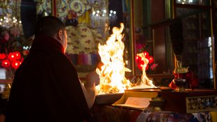 Thaye Dorje, His Holiness the 17th Gyalwa Karmapa, presides over a fire puja at His Eminence Beru Khyentse Rinpoche's guest house, India, December 2019. Photo / Norbu Zangpo