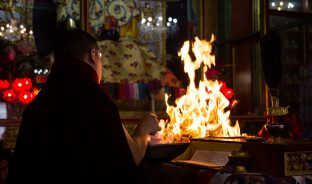 Thaye Dorje, His Holiness the 17th Gyalwa Karmapa, presides over a fire puja at His Eminence Beru Khyentse Rinpoche's guest house, India, December 2019. Photo / Norbu Zangpo