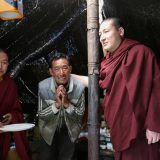 During a break in travelling, Thaye Dorje, His Holiness the 17th Gyalwa Karmapa, is received by a nomad family. Photo / Magda Jungowska