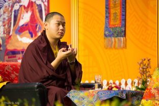 His Eminence 4th Jamgon Kongtrul Rinpoche offers a mandala during the Chenresig empowerment given by Thaye Dorje, His Holiness the 17th Gyalwa Karmapa, to around 2,000 people in Hong Kong