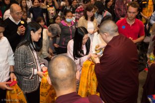 Sangyumla Rinchen Yangzom receives a blessing from Thaye Dorje, His Holiness the 17th Gyalwa Karmapa, at the Chenresig empowerment in Hong Kong