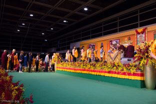Participants offer symbolic gifts and receive blessing from Thaye Dorje, His Holiness the 17th Gyalwa Karmapa, during the puja for the deceased, Hong Kong