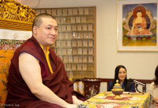 Thaye Dorje, His Holiness the 17th Gyalwa Karmapa, visits the New Horizon Buddhist Association Bodhi Path Buddhist Centre in Hong Kong. His wife, Sangyumla Rinchen Yangzom, looks on in the background.