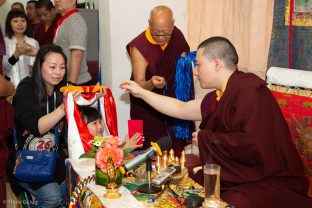 Devotees make symbolic offerings and receive blessings at the Bodhi Path Tara Buddhist Centre of Lama Jakarla in Hong Kong