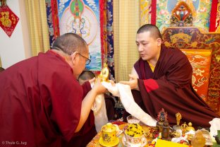 Students and visitors make symbolic offerings and receive blessings from Thaye Dorje, His Holiness the 17th Gyalwa Karmapa, at Khenpo Karsang’s Kagyu Library in Hong Kong
