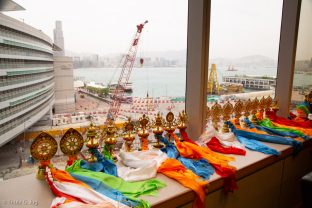 Audiences with Thaye Dorje, His Holiness the 17th Gyalwa Karmapa, with Hong Kong harbour in the background