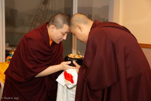 Jangon Kongtrul Rinpoche receives a bowl from Thaye Dorje, His Holiness the 17th Gyalwa Karmapa