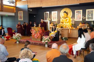 Students pray with Thaye Dorje, His Holiness the 17th Gyalwa Karmapa, Sangyumla Rinchen Yangzom, and Thugsey (their son) at Dhagpo Kagyu Ling