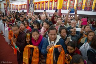 A large group of students eagerly await Karmapa's arrival