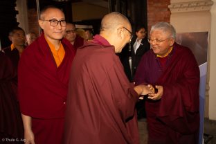 Jigme Rinpoche, Karmapa's General Secretary, is welcomed by Shangpa Rinpoche. Lodro Rinpoche in the background.