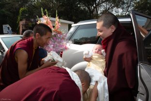 Karmapa and his four month old son Thugsey arrive at KIBI