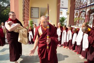 Monks greet Karmapa and baby Thugsey