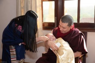 Karmapa and Sangyumla Rinchen Yangzom share a special moment with their son Thugsey