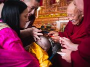 The moment when His Eminence Luding Khenchen Rinpoche, the 75th head of the Ngor tradition of the Sakya school of Tibetan Buddhism, cuts the hair of Thugsey, symbolizing his taking refuge in the Three Jewels: the Buddha, the dharma and the sangha