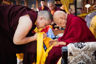 A moment of deep respect as Thaye Dorje, His Holiness the 17th Gyalwa Karmapa, offers His Eminence Luding Khenchen Rinpoche a mandala and a symbolic offering of body, speech and mind