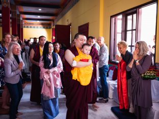 Sangyumla and students smile as Karmapa walks Thugsey through KIBI on the last day of the Karmapa Public Course 2019