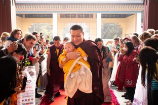 Thaye Dorje, His Holiness the 17th Gyalwa Karmapa, brings his son Thugsey with him to the Public Meditation Course at KIBI. His wife, Sangyumla Rinchen Yangzom, follows closely behind