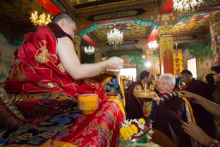 Students line up to present Karmapa with offerings