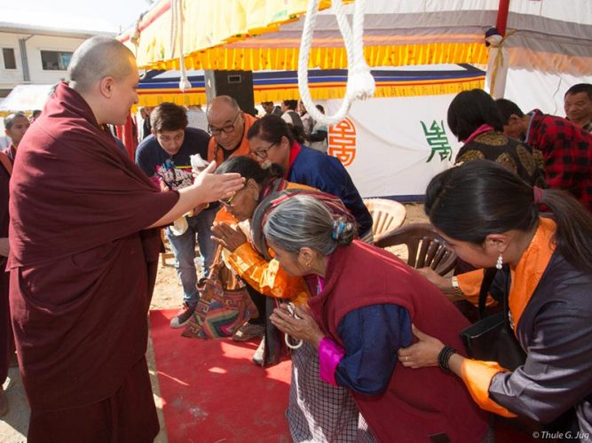 Devotees being blessed by Thaye Dorje, His Holiness the 17th Gyalwa Karmapa. Photo / Thule Jug