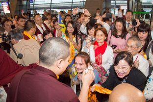 Thaye Dorje, His Holiness the 17th Gyalwa Karmapa, greets devotees in Taipei International Airport. Photo / Thule Jug