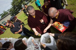 Thaye Dorje, His Holiness the 17th Gyalwa Karmapa, blessing fish before releasing them into the river