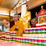 Thaye Dorje, His Holiness the 17th Gyalwa Karmapa, blessing mantra rolls in France 2015. Photo / Thule Jug