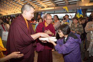 Thaye Dorje, His Holiness the 17th Gyalwa Karmapa, is offered a ceremonial silk scarf. Photo / Thule Jug