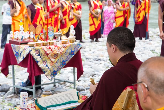 Preparing the mandala offering to be poured into the river on the 3rd anniversary of the parinirvana of His Holiness Kunzig Shamar Rinpoche. Photo / Magda Jungowska