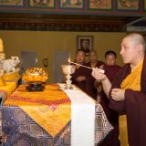 Tribute to Shamar Rinpoche: Thaye Dorje, His Holiness the 17th Gyalwa Karmapa, places Shamar Rinpoche's relics on the main altar. Photo / Thule Jug