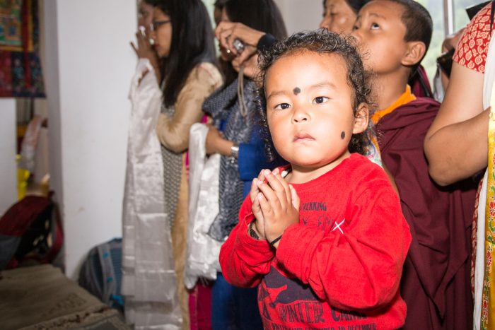 Children welcome Thaye Dorje, His Holiness the 17th Gyalwa Karmapa, to Thagda Diwakar Buddhist School. Photo / Magda Jungowska